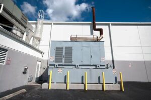 commercial generator in enclosure outside building